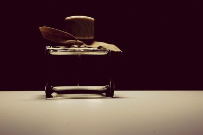 Close-up of electric lamp against black background