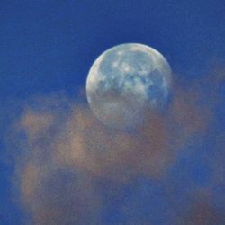 Close-up of moon against blue sky