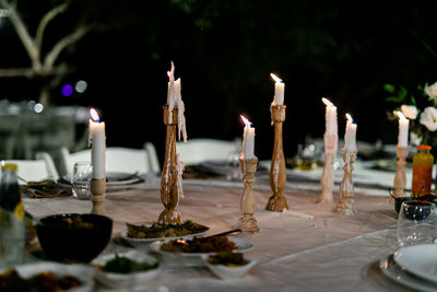 Luxury table settings for fine dining with and glassware, pouring wine to glass.