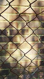 Full frame shot of chainlink fence against sky