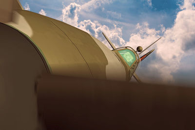 Low angle view of airplane against sky