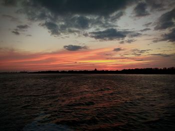 Scenic view of sea against sky at sunset