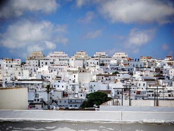 Buildings in city against sky