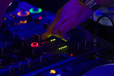 Night club music instrument dj controller and dj hands, playing music scene.