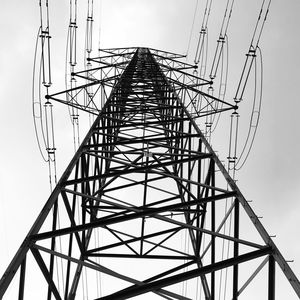 Low angle view of electricity pylon against sky