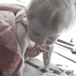 Close-up of cute girl standing at home