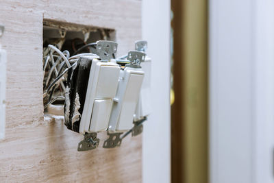 Close-up of electric lamp on table at home