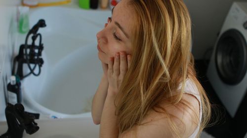 Portrait of woman in bathroom