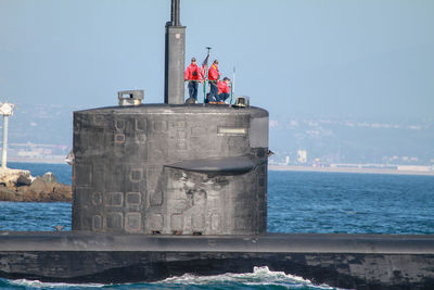 Built structure in sea against sky