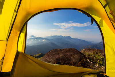 Scenic view of mountains seen through window