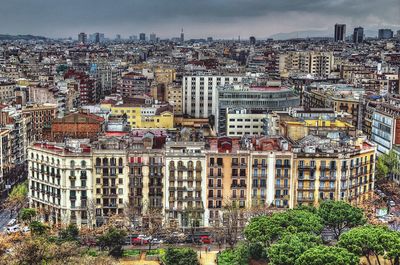 High angle view of buildings in city against sky