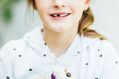 Midsection of girl with gap toothed