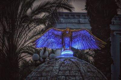 Low angle view of built structure with trees in foreground