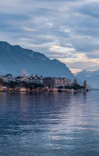 Scenic view of sea and buildings against sky