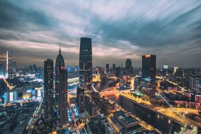 Aerial view of city lit up at night