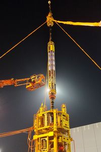 Low angle view of illuminated building at night