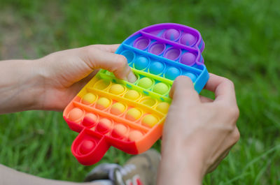 Cropped hand of woman holding pills