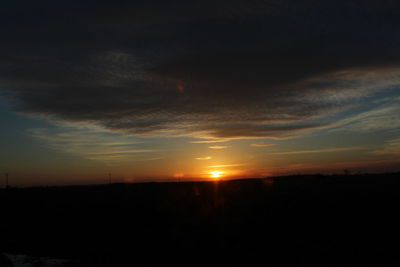 Silhouette landscape against sky during sunset