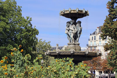 Low angle view of statue against sky