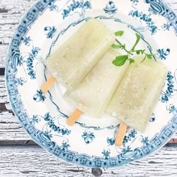 Directly above shot of popsicles with mint on plate