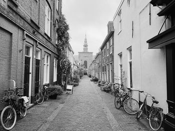 Bicycles on street amidst buildings in city