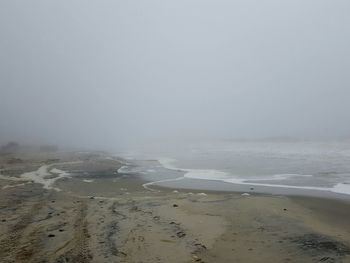 Scenic view of beach against clear sky