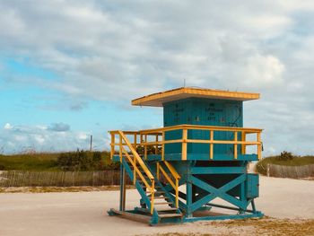 Built structure on beach against sky