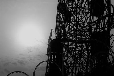 Low angle view of ferris wheel against sky