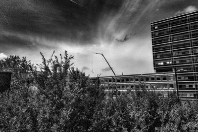 Low angle view of building against cloudy sky