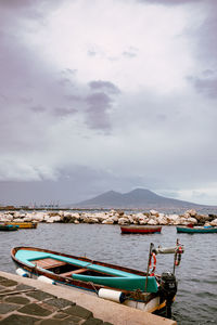 Boats in sea against sky