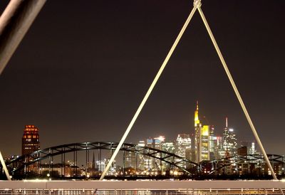 Illuminated modern buildings in city at night