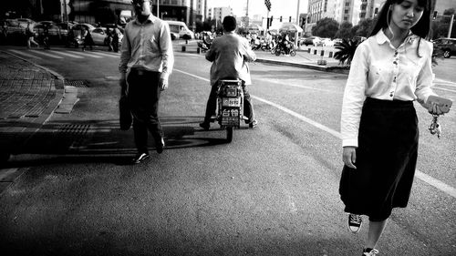 People walking on street in city