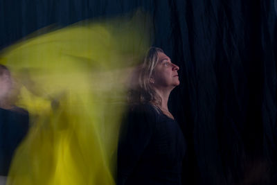Time lapse view of woman moving a rag. long exposure, motion blur. 