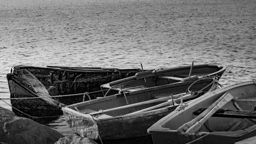 Abandoned boat moored on beach