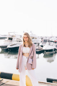 Woman standing on boat in water