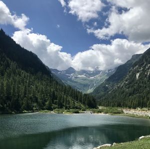 Scenic view of lake and mountains against sky