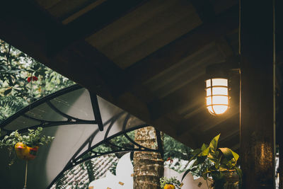 Low angle view of illuminated lights hanging from ceiling