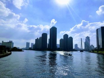 Panoramic view of river and buildings against sky