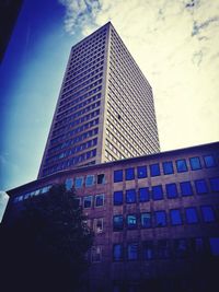 Low angle view of skyscraper against sky