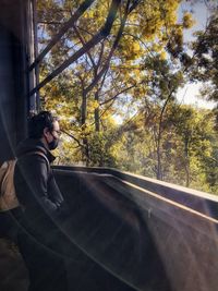 Man seen through car window