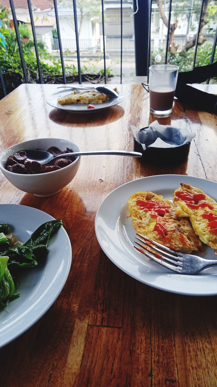 food and drink, food, table, plate, dish, meal, fast food, no people, freshness, wood, indoors, healthy eating, restaurant, day, high angle view, cuisine, wellbeing, vegetable, lunch, still life, breakfast, crockery, household equipment, plant, bowl, eating utensil