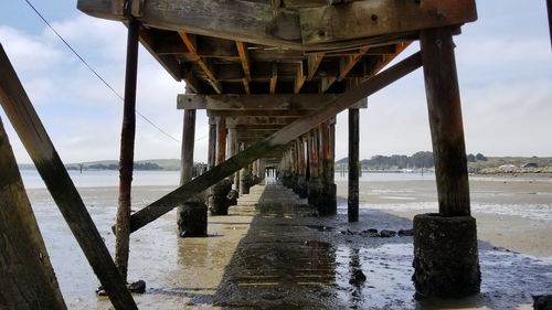 Pier over sea against sky