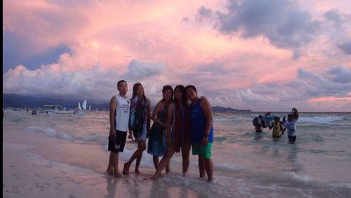 People on beach at sunset