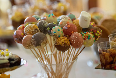 Close-up of multi colored candies on table