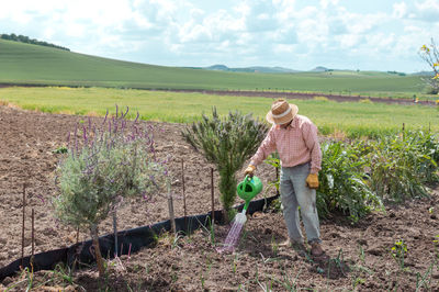 Full length of man working on field