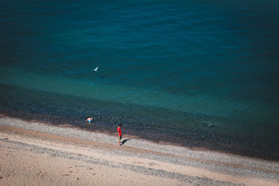 Man standing on beach against sky