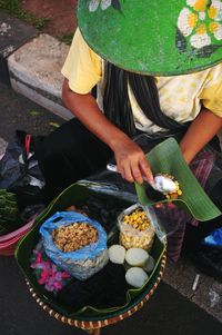 High angle view of woman holding food