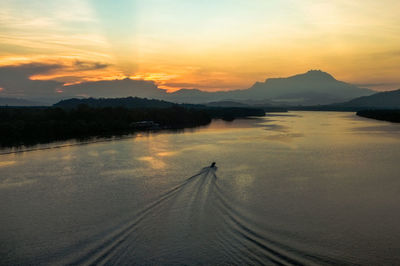 Scenic view of landscape against sky during sunset