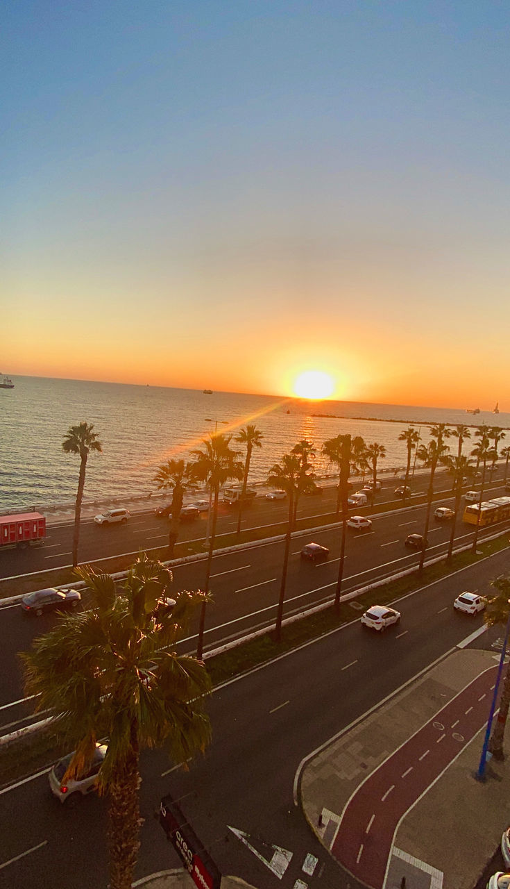 HIGH ANGLE VIEW OF ROAD BY SEA AGAINST SKY