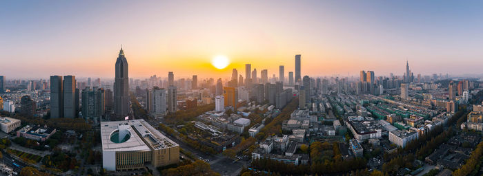 Panoramic view of city against sky during sunset